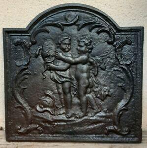 Ancienne plaque de cheminée en fonte - les cherubins -